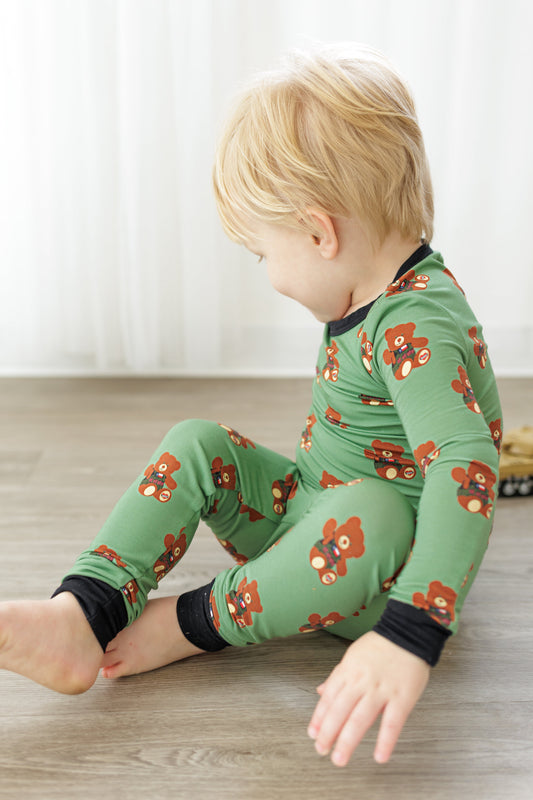 Toddler in Green, Black, Brown Pajamas