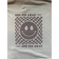 Gray t-shirt with a smiley face design and 'One Pin Away' text on a white background