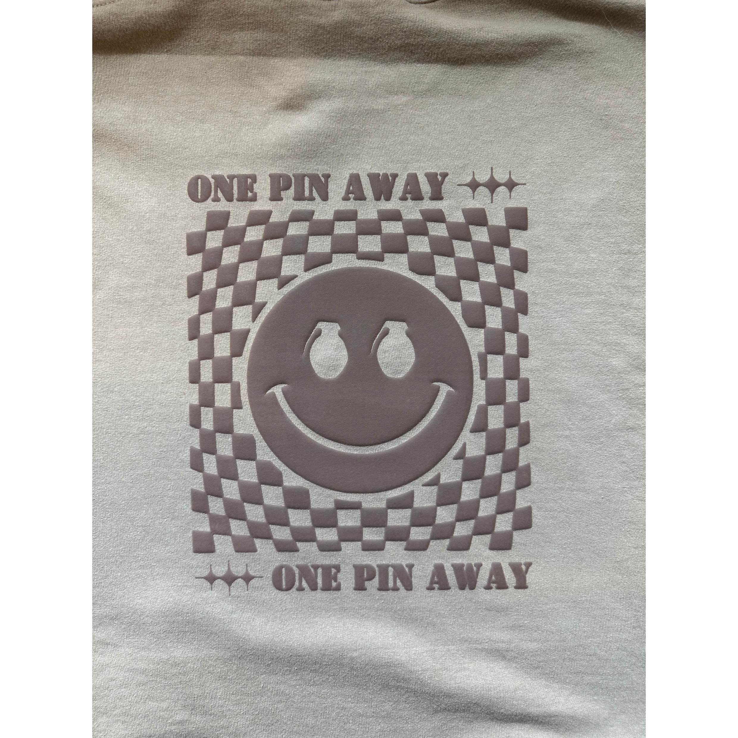 Gray t-shirt with a smiley face design and 'One Pin Away' text on a white background
