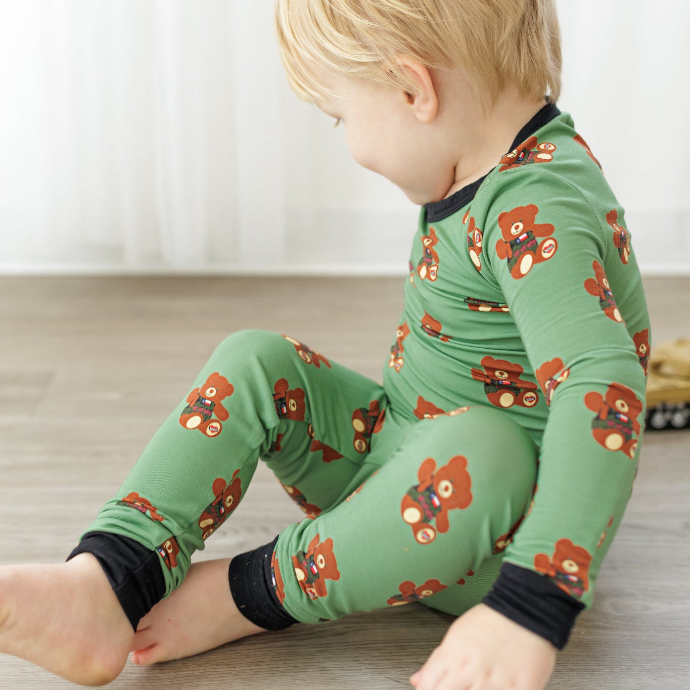 Toddler in Green, Black, Brown Pajamas