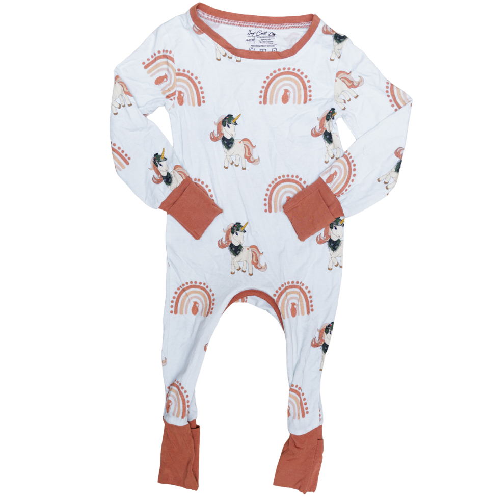 Baby onesie with animal and rainbow pattern on a white background